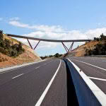 Highway with bridge in rural landscape