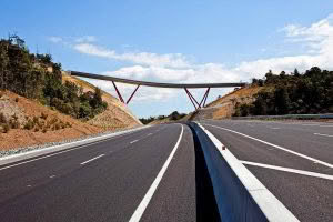 Highway with bridge in rural landscape