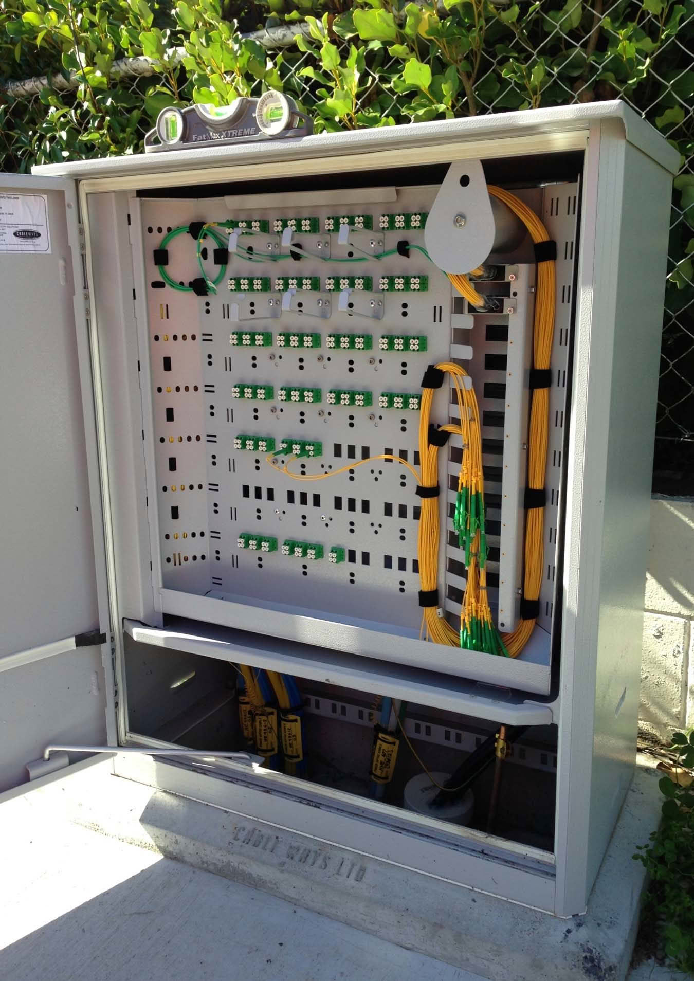 Open fiber cabinet with cables